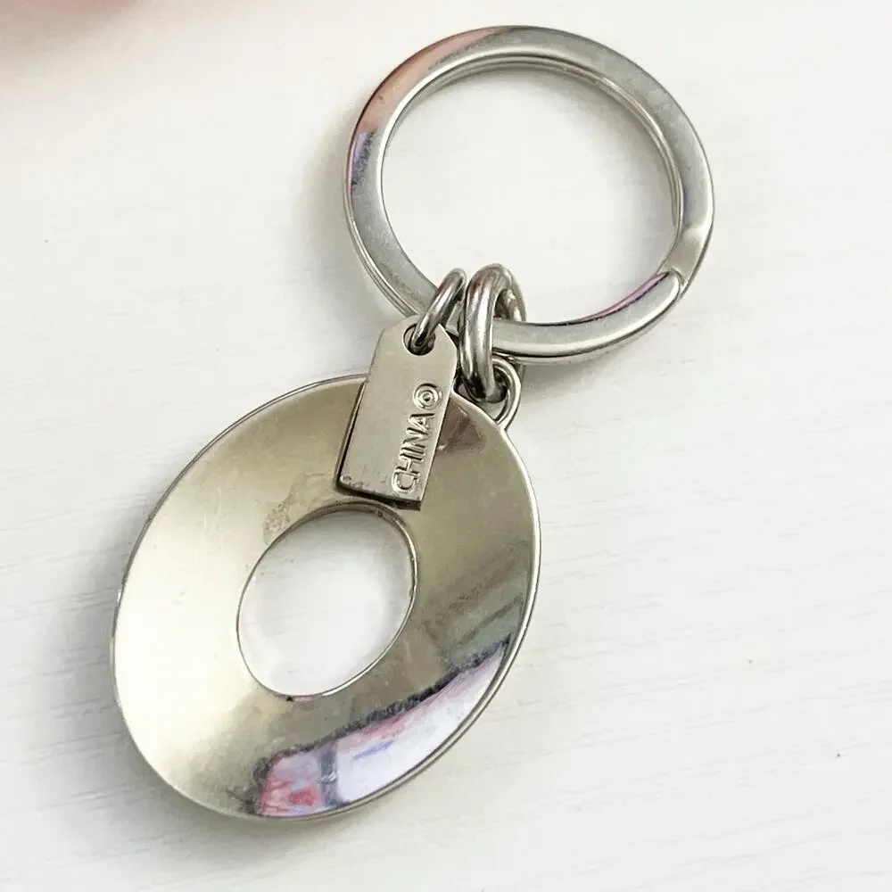 Coach Silver Tone Oval Signature C Keychain